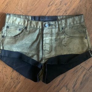 One Teaspoon distressed metallic gold shorts.